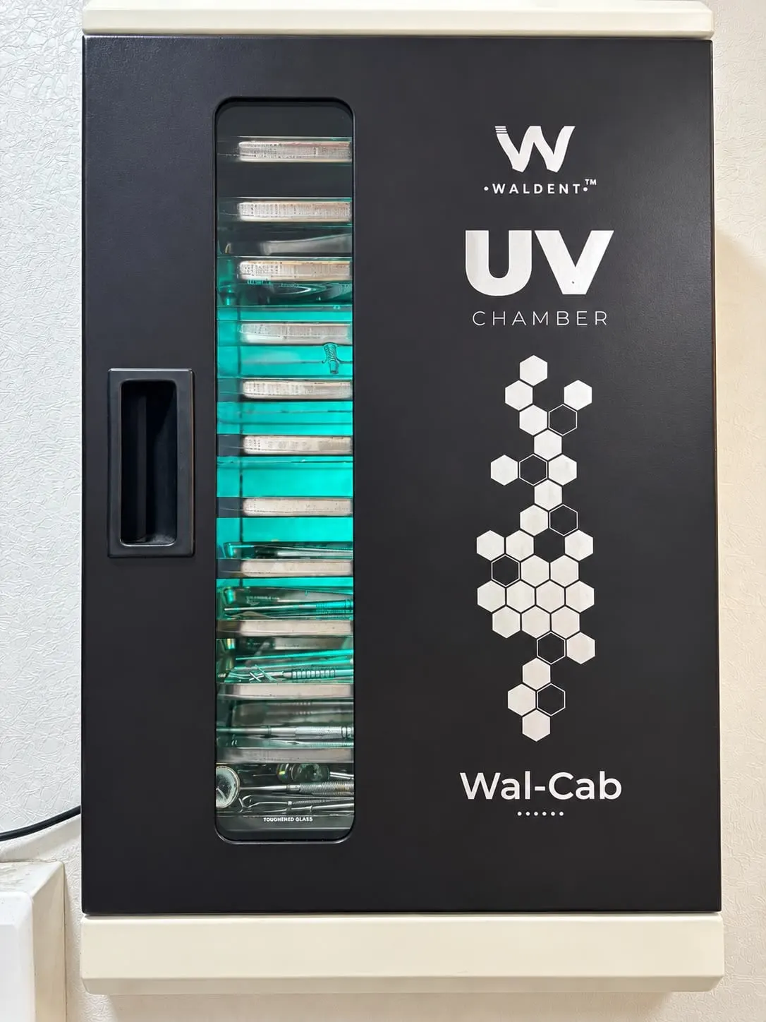 UV cabinet storing sterilised dental instruments